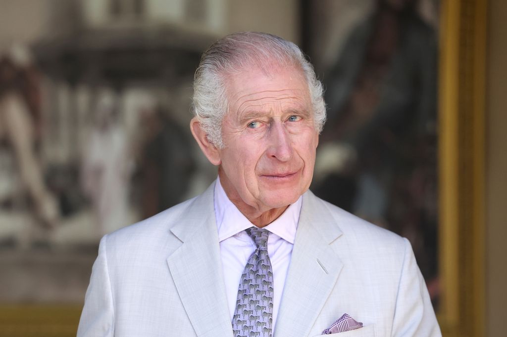 King Charles in a grey suit