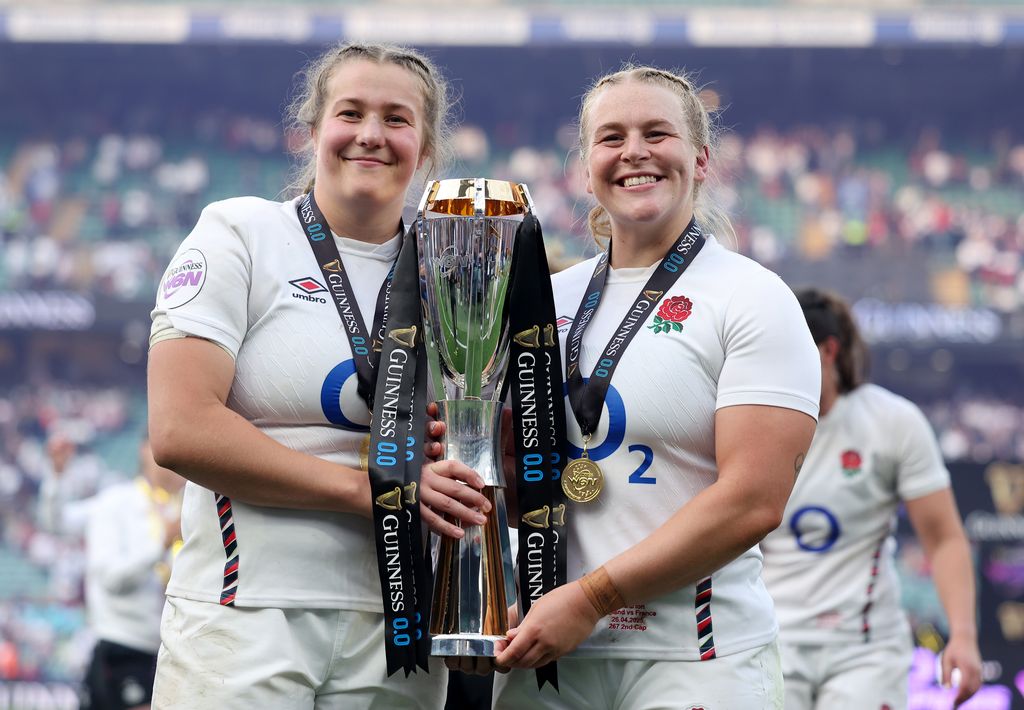 Morwenna Talling of England poses for a photograph with Abi Burton and the Guinness Women's Six Nations Trophy