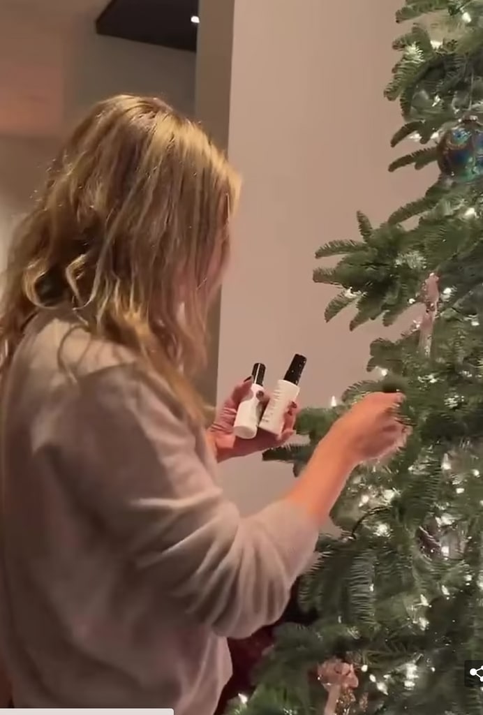 Jennifer decorates her tree inside her $21million mansion