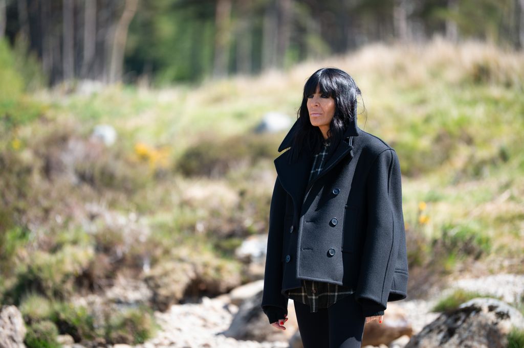 Claudia Winkleman wearing a black cropped pea coat on The Traitors 2026