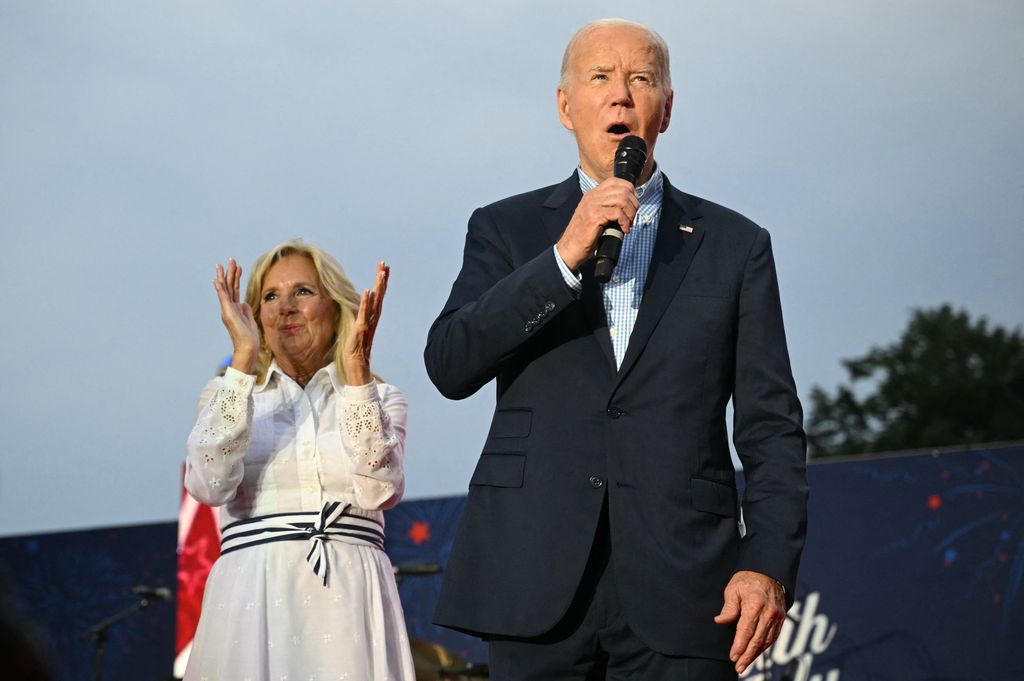 First Lady Jill Biden (L) applauds as US President Joe Biden speaks during a Fourth of July celebration for military and veteran families, caregivers, and survivors