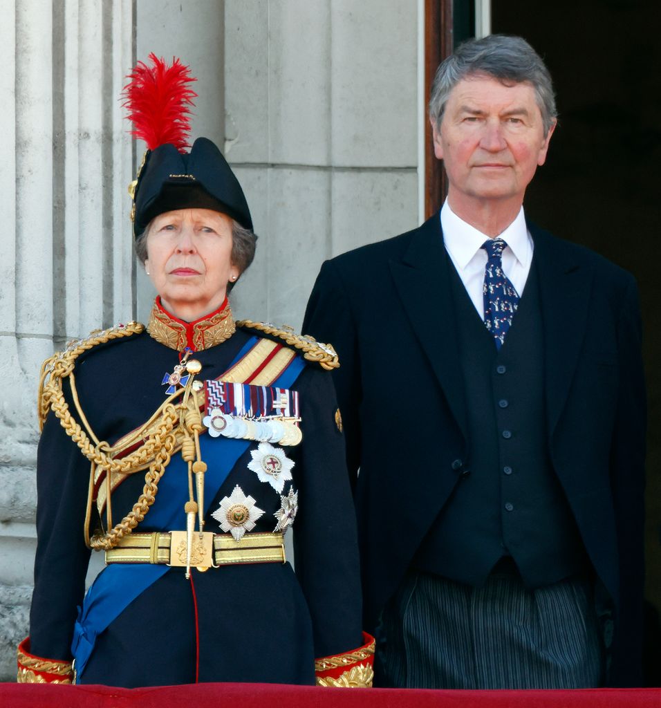 Princess Anne and Sir Timothy Laurence stand on the balcony of Buckingham Palace