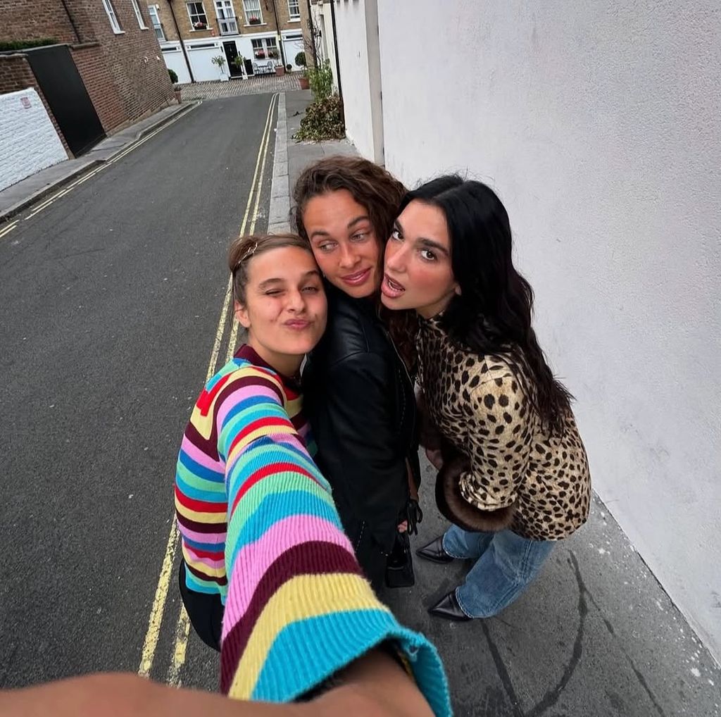 Rosie viva in rainbow knit with long-term friends Sarah Lysander and Dua Lipa