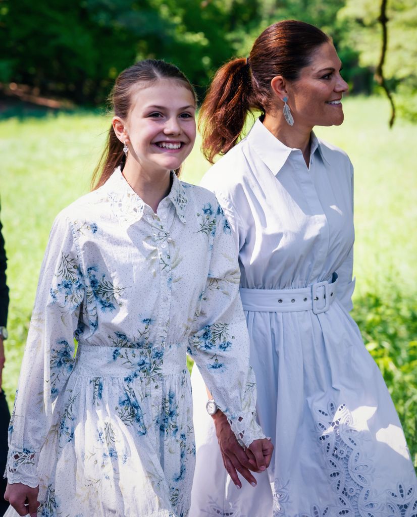 Crown Princess Victoria and Princess Estelle walking hand in hand