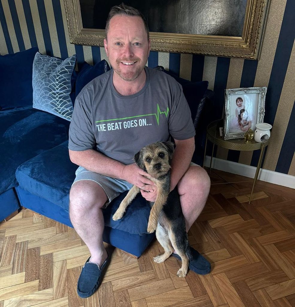 John Cameron at home with his dog Polly