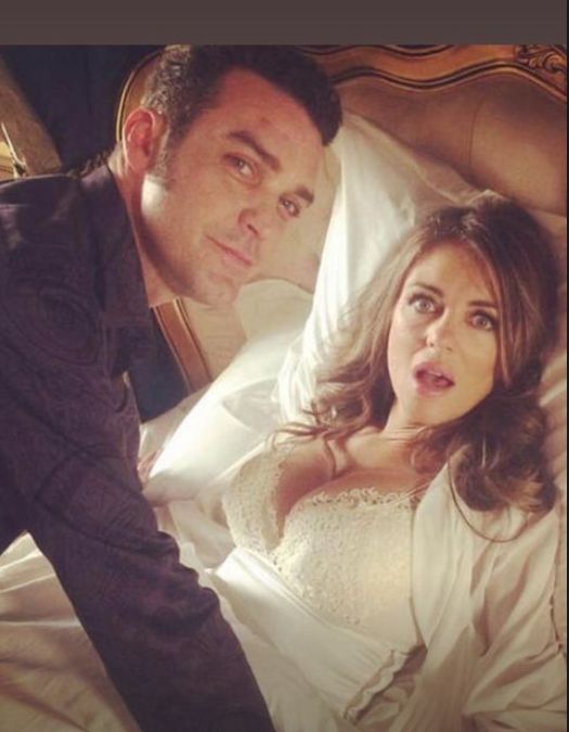Jake Maskall on top of Elizabeth Hurley (not in a sexual way)