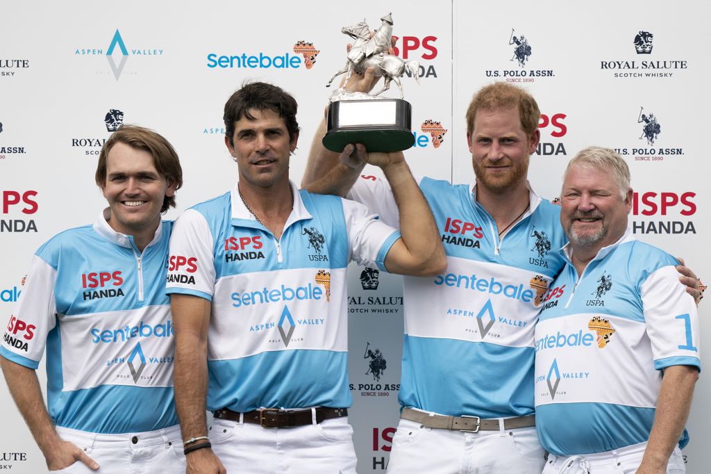 Grant Ganzi, Nacho Figueras, the Duke of Sussex and Steve Cox raise the trophy 