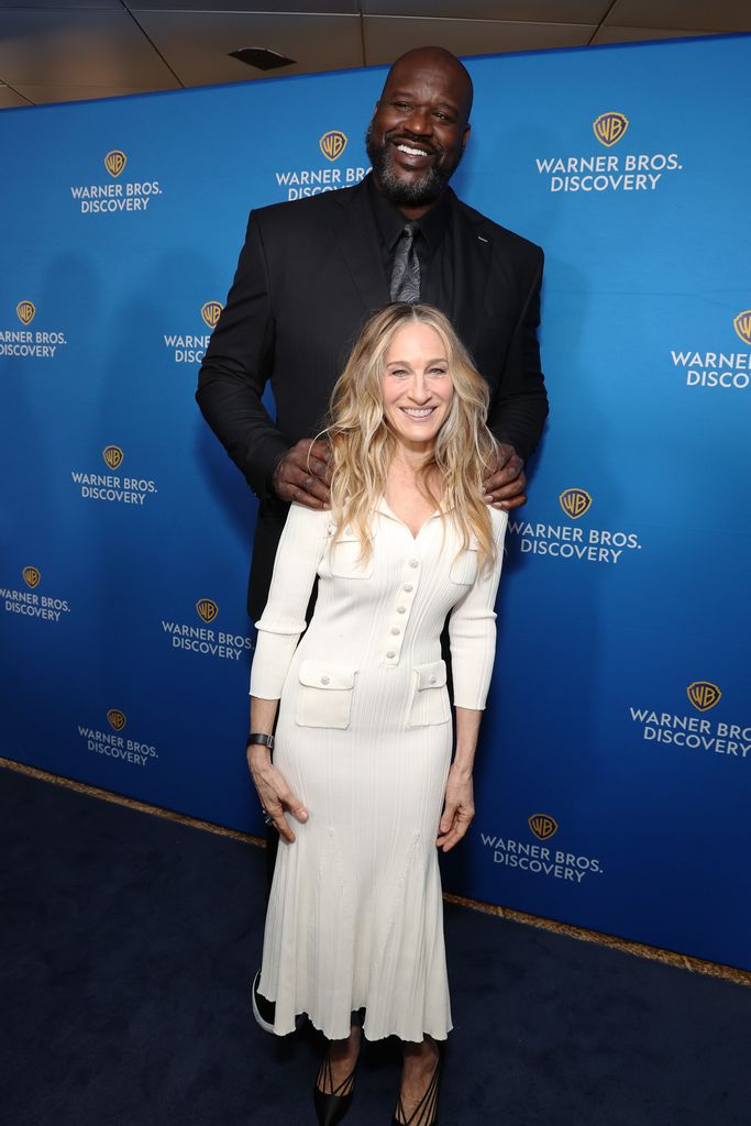 Shaquille O'Neal towering over Sarah Jessica Parker