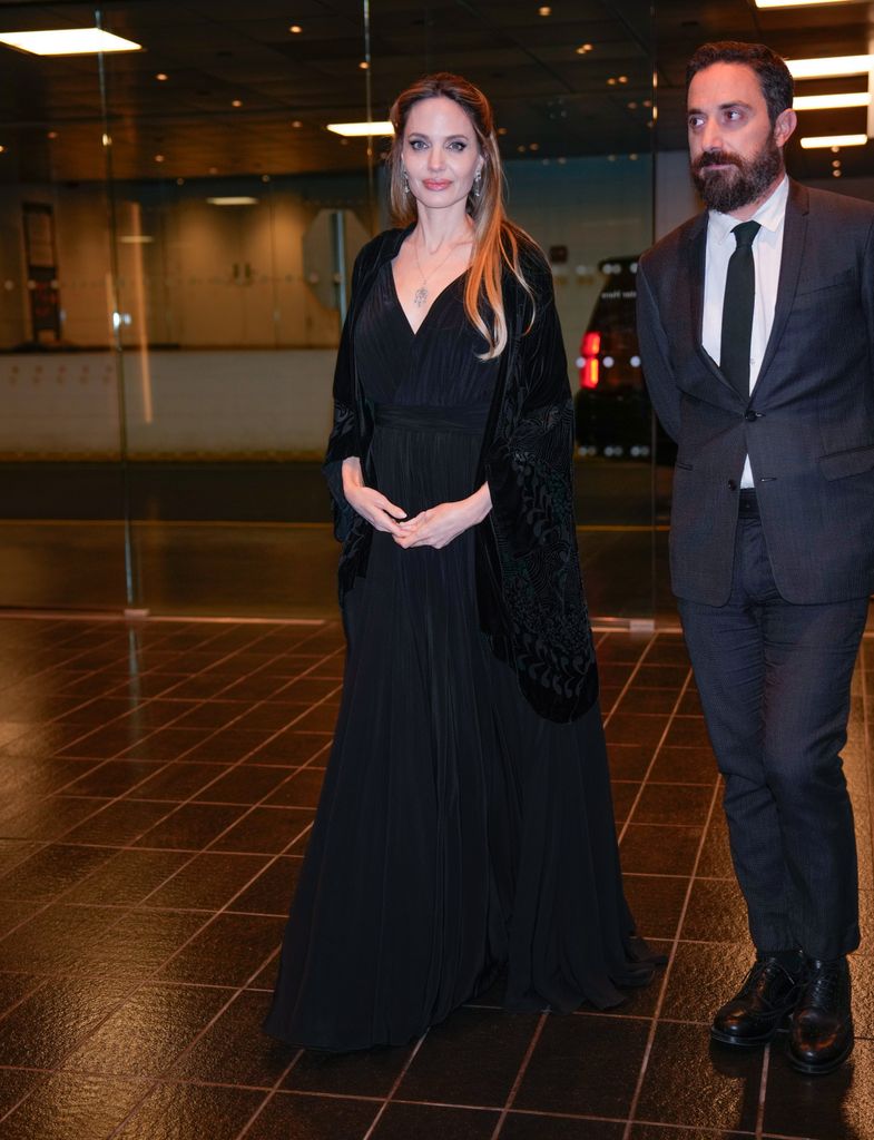 Angelina Jolie in black dress and Pablo LarraÃ­n are seen in New York City