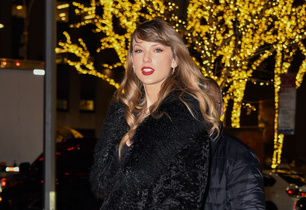 Taylor Swift arrives to the "Poor Things" premiere after party in a black fur coat