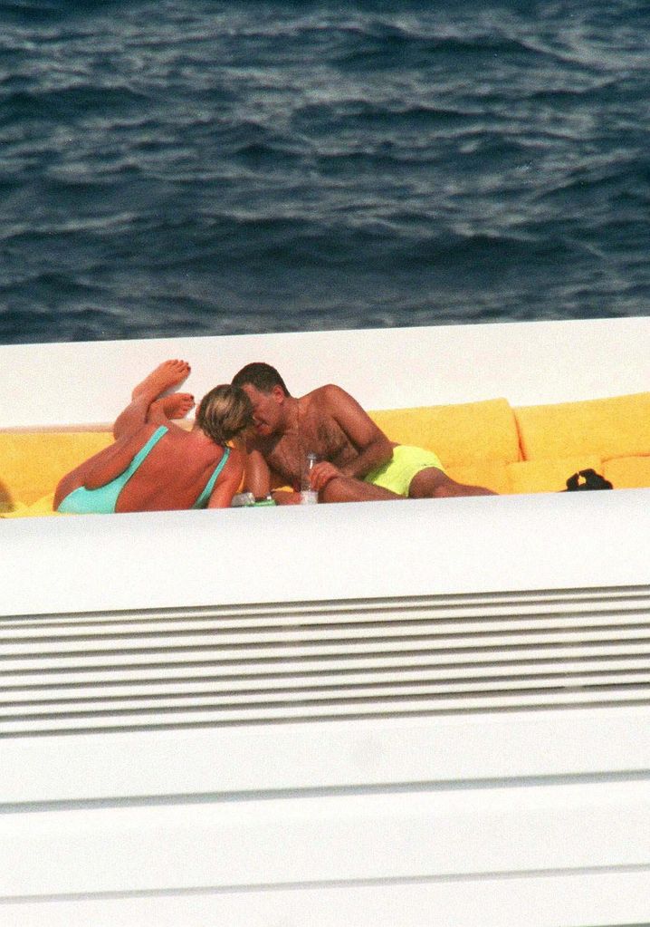 Princess Diana and Dodi al-Fayed embracing on the deck of a yacht