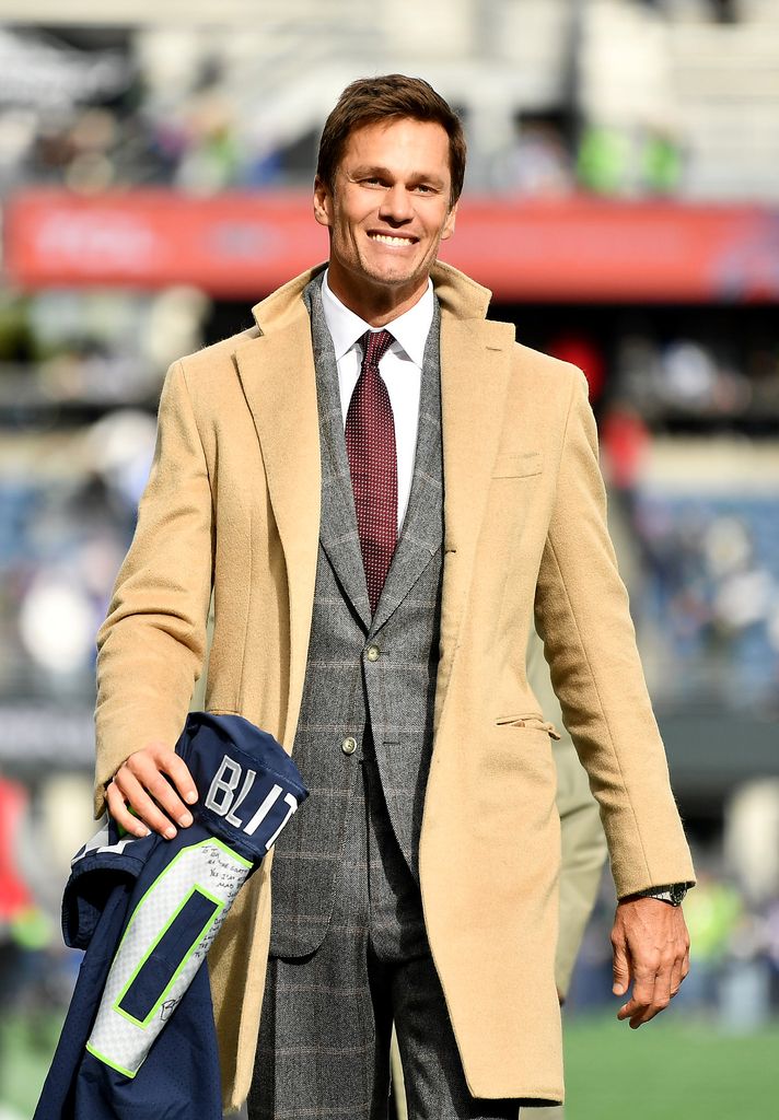 Tom Brady is seen on the field prior to a game between the Seattle Seahawks and the Buffalo Bills at Lumen Field on October 27, 2024 in Seattle, Washington