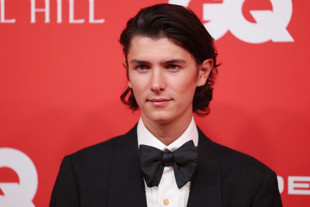 Count Nikolai in a black suit and bow tie