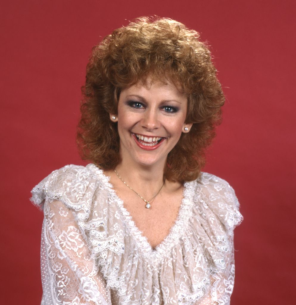  Reba McEntire in a white lace top