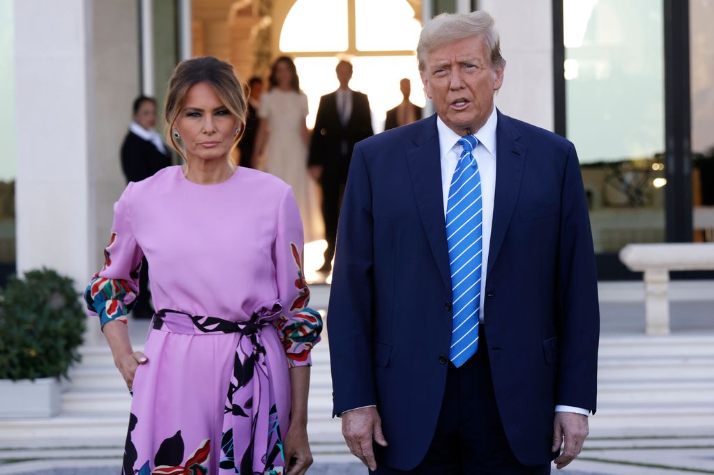 Republican presidential candidate, former U.S. President Donald Trump, arrives with former first lady Melania Trump at the home of billionaire investor John Paulson in Palm Beach, Florida, on April 6, 2024. Donald Trump's campaign expects to raise more than $40 million as major donors come together for his biggest fundraising campaign yet. The event will be billed as "Executive Opening Dinner".