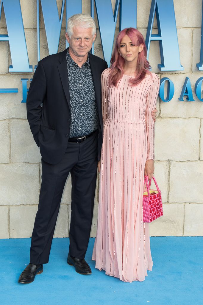 Richard Curtis with his arm around daughter Scarlett Curtis