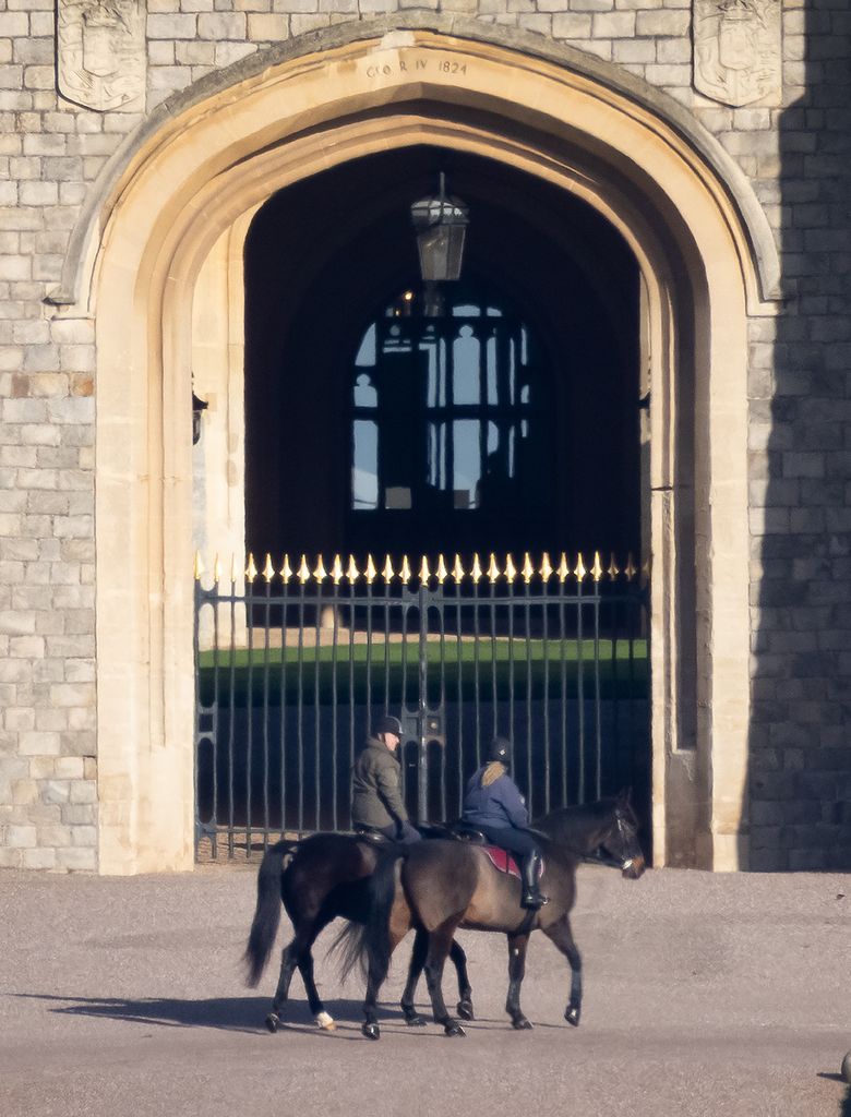 Andrew Mountbatten Windsor is seen out riding with a groom at Windsor Castle today for the first time since losing his royal titles. 
