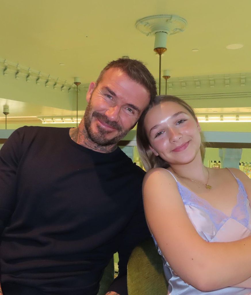 Harper pictured with her dad David at the Prada Caffe