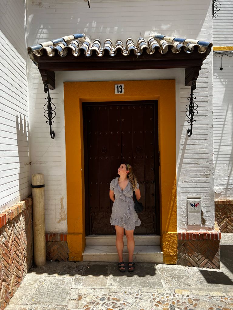 Georgia wearing a gingham dress in Seville