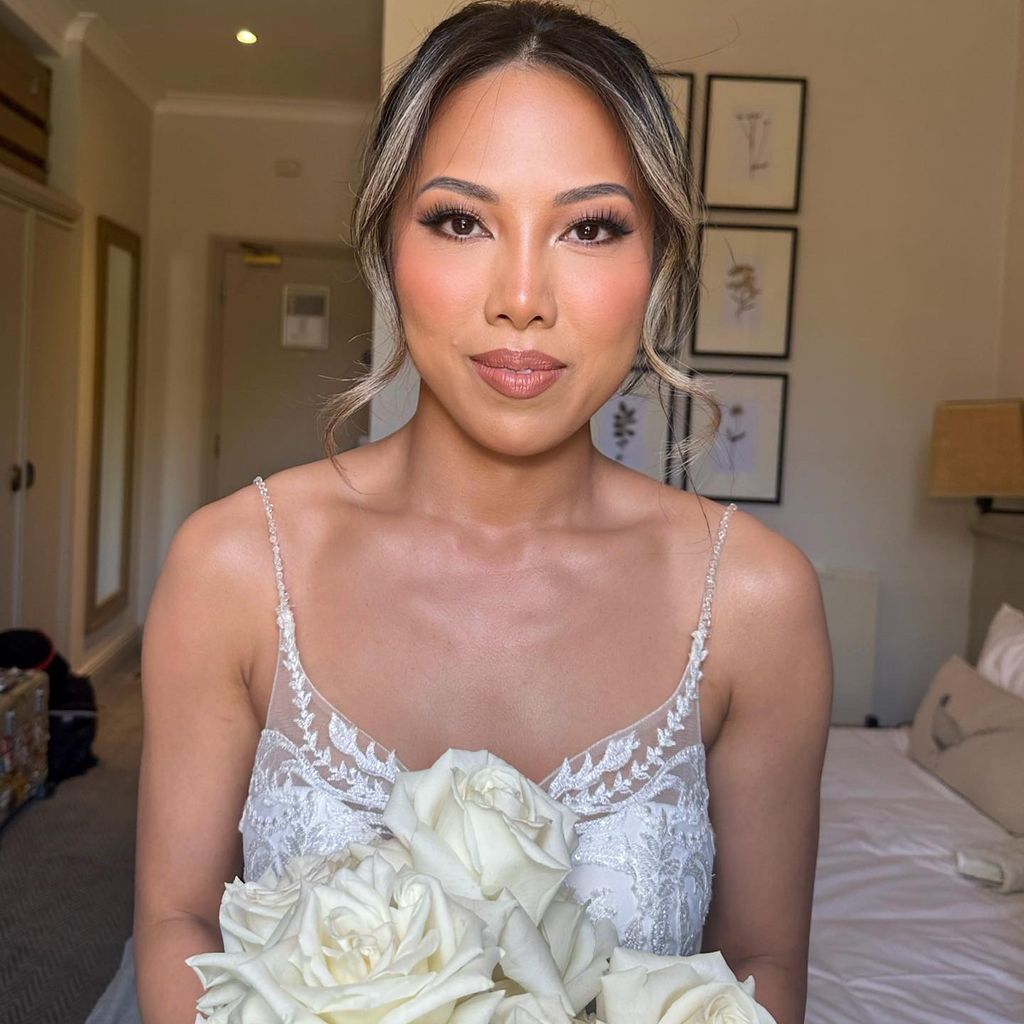 bride with hair up in strappy dress