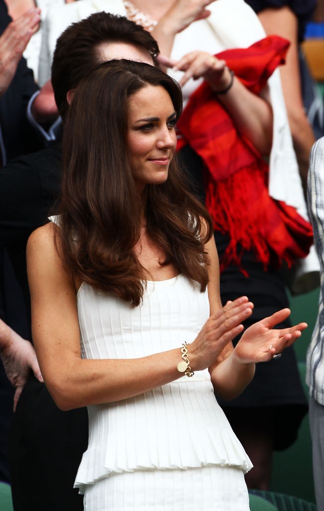 Kate Middleton wearing a white dress and gold bracelet at Wimbledon in 2011