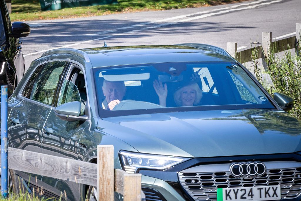 charles and camilla in audi grey car