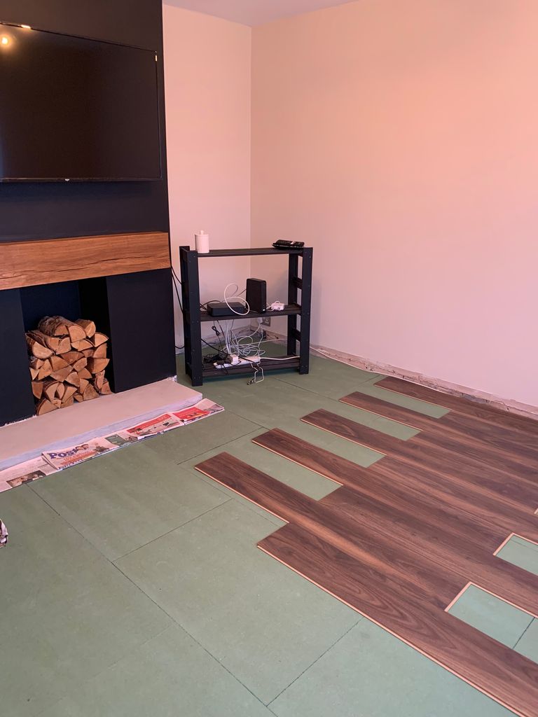 laminate flooring being laid in lounge