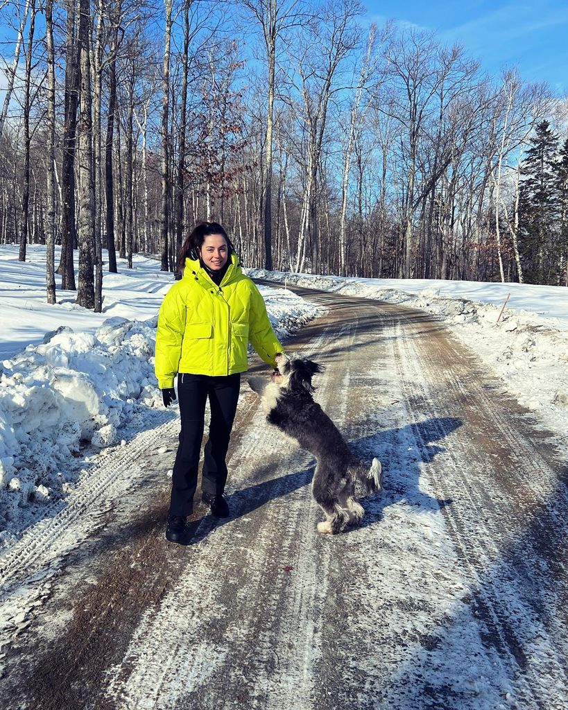 Ana in snow outside with dog