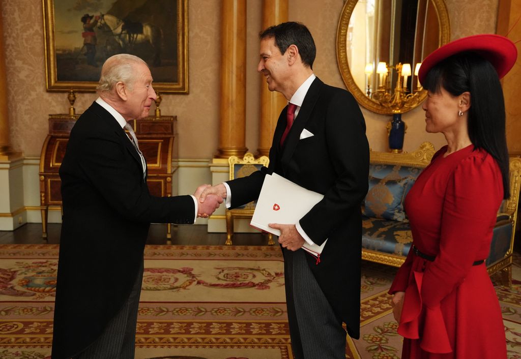 Switzerland's Ambassador to the United Kingdom, Dominique Paravicini accompanied by his wife  
