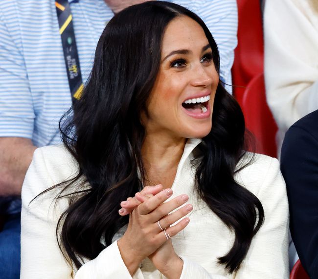 meghan claps wearing little sparkly rings