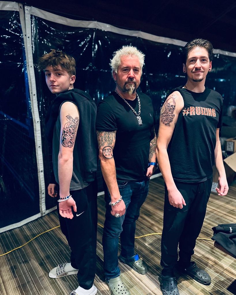 Guy Fieri and his sons Ryder and Hunter pose showing off their tattoos, shared on Instagram