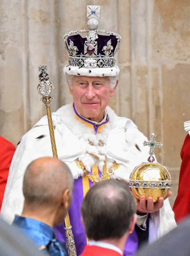 King Charles in the Imperial State Crown while carrying the sovereign's Orb and Sceptre
