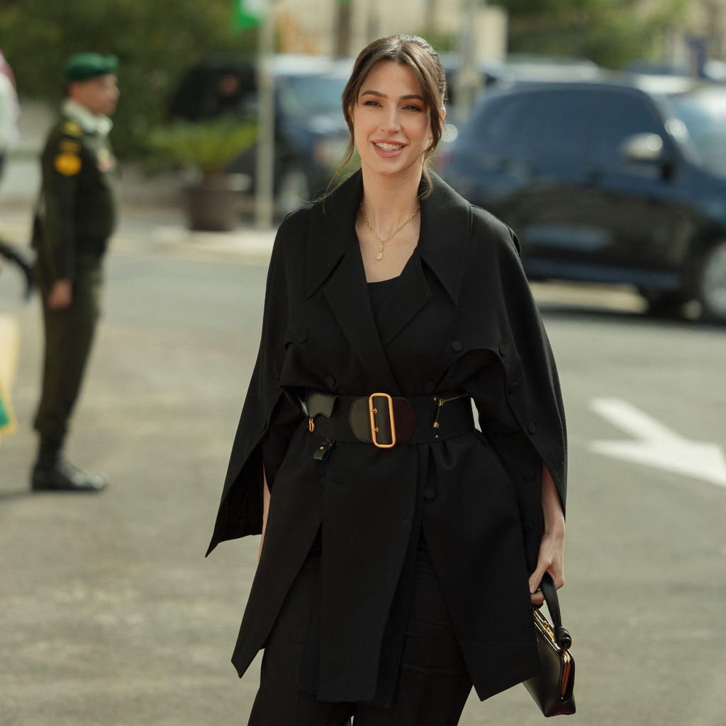 Princess Rajwa arrives to Parliament in black belted coat