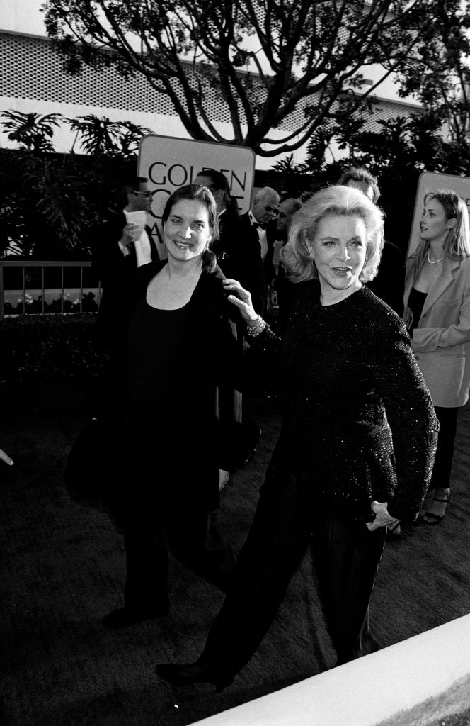 (L-R, foreground) Leslie Howard Bogart and her mother, Lauren Bacall, attend the 54th Golden Globe Awards at the Beverly Hilton Hotel in Beverly Hills, California, on January 19, 1997. (Photo by Donato Sardella/Penske Media via Getty Images)