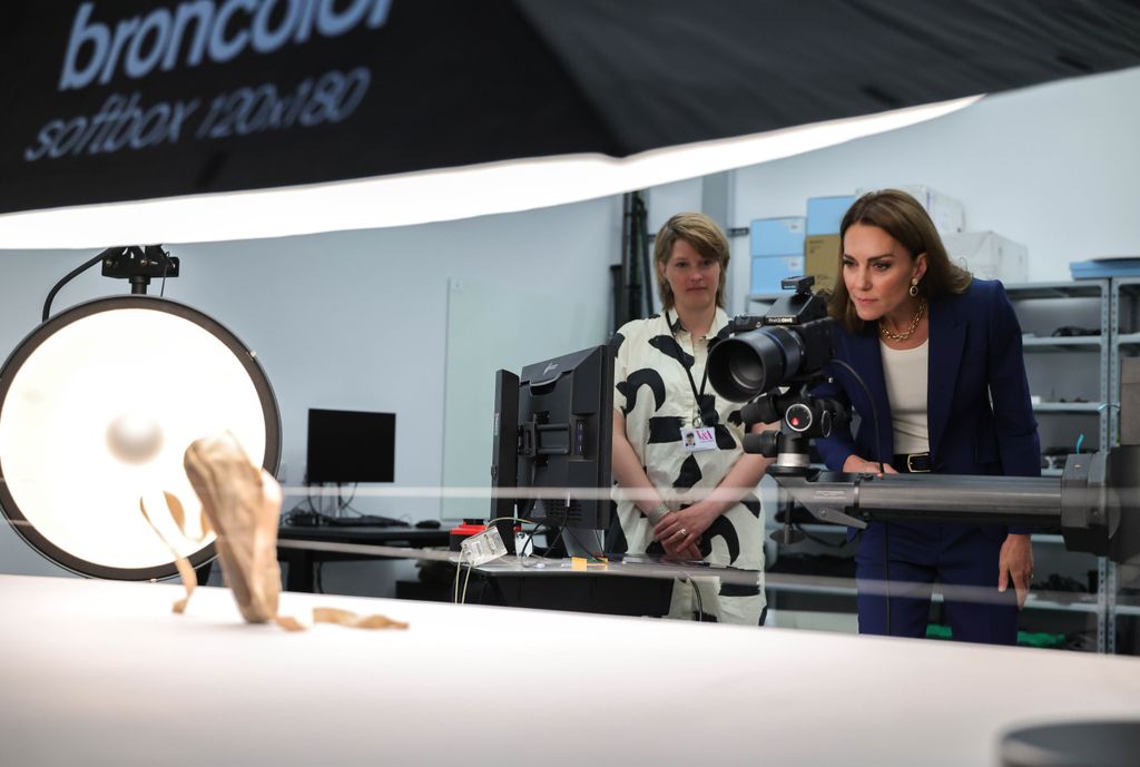 princess kate looking at ballet shoe through lens