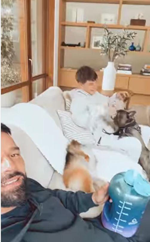 Ricky Martin and son with two dogs