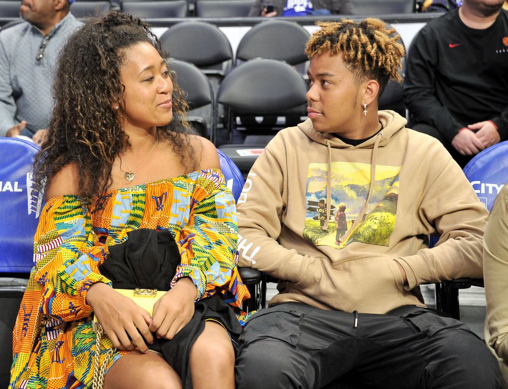 Naomi Osaka and YBN Cordae attend a basketball game between the Los Angeles Clippers and the Washington Wizards at Staples Center on December 01, 2019 in Los Angeles, California