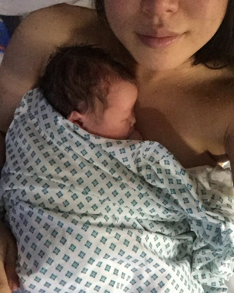 Dara Huang cuddling baby Wolfie in the hospital following his birth