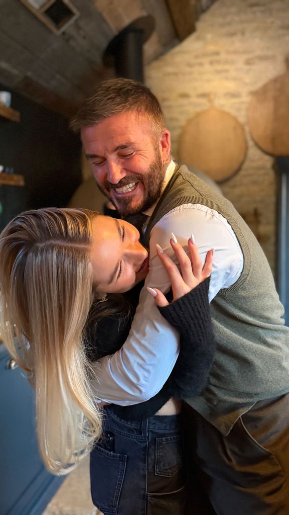 Harper Beckham hugging dad David Beckham during Christmas in the Cotswolds
