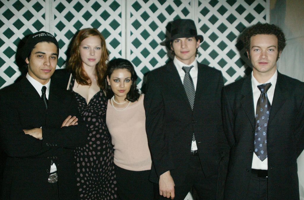 Actors Wilmer Valderrama, Laura Prepon, Mila Kunis, Ashton Kutcher and Danny Masterson pose backstage at the Church of Scientology's 11th Annual Christmas Stories Fundraiser