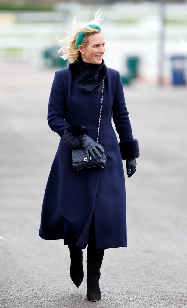 Zara Tindall braves the weather as she attends the 'Festival Trials Day' meet at Cheltenham Racecourse