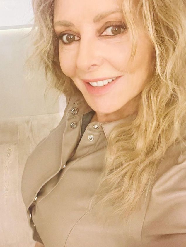 Carol Vorderman in tan leather outfit