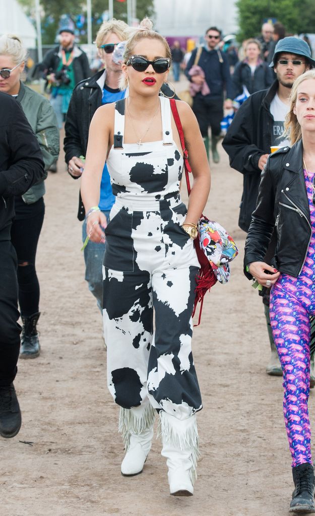 Rita Ora attends Glastonbury in 2014 wearing cow print overalls 