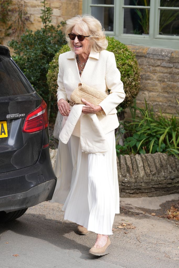 Annabel Elliot in cream blazer and white pleated skirt