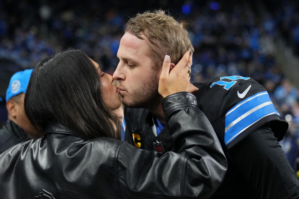 Jared Goff kisses his wife, Christen Harper Goff on field at the game against the Buffalo Bills