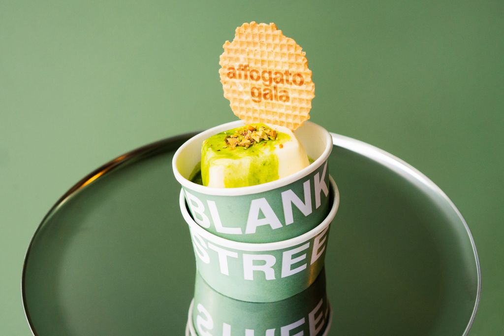 Blank Street's pistachio affogato with a wafer on top