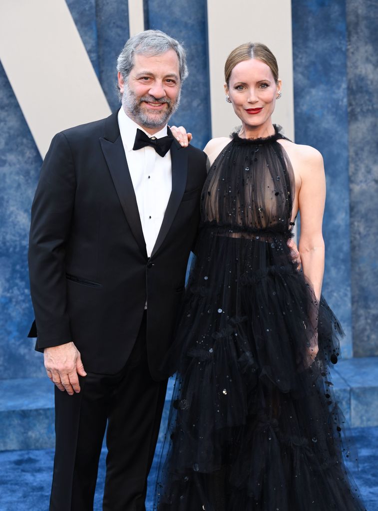 Leslie Mann in a black sheer dress with her husband Judd Apatow in a tuxedo at the 2023 Vanity Fair Oscar Party 