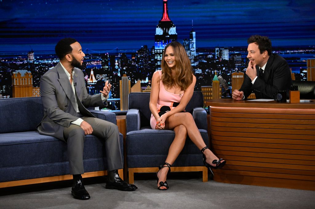 THE TONIGHT SHOW STARRING JIMMY FALLON -- Episode 1965 -- Pictured: (l-r) John Legend & Chrissy Teigen during an interview with host Jimmy Fallon on Thursday, May 2, 2024 -- (Photo by: Todd Owyoung/NBC via Getty Images)