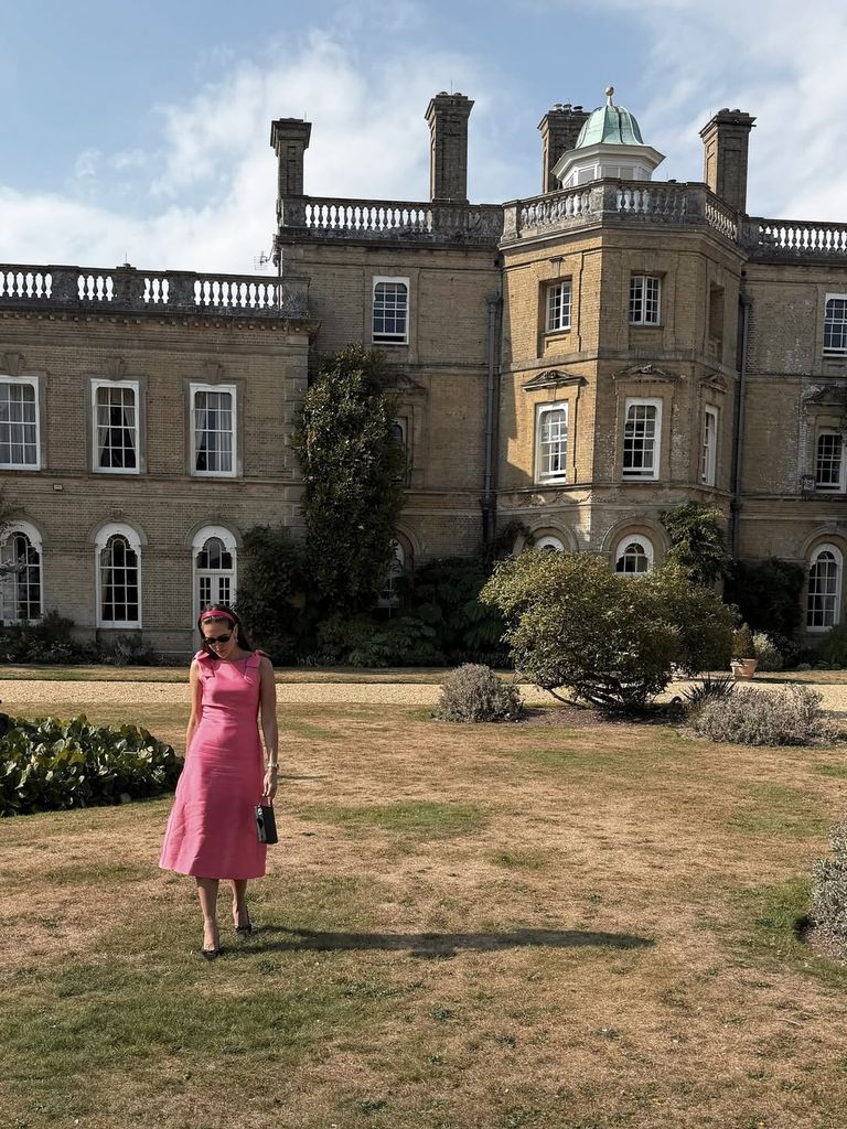 Fashion Tech Journalist and The Modems founder Natalie Salmon wears pink dress and black sunglasses