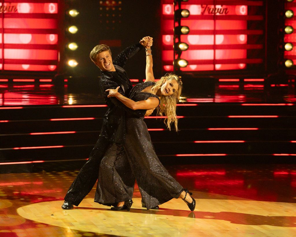 Robert Irwin and Witney Carson perform during the Judges' Choice round in the DWTS 2025 finale